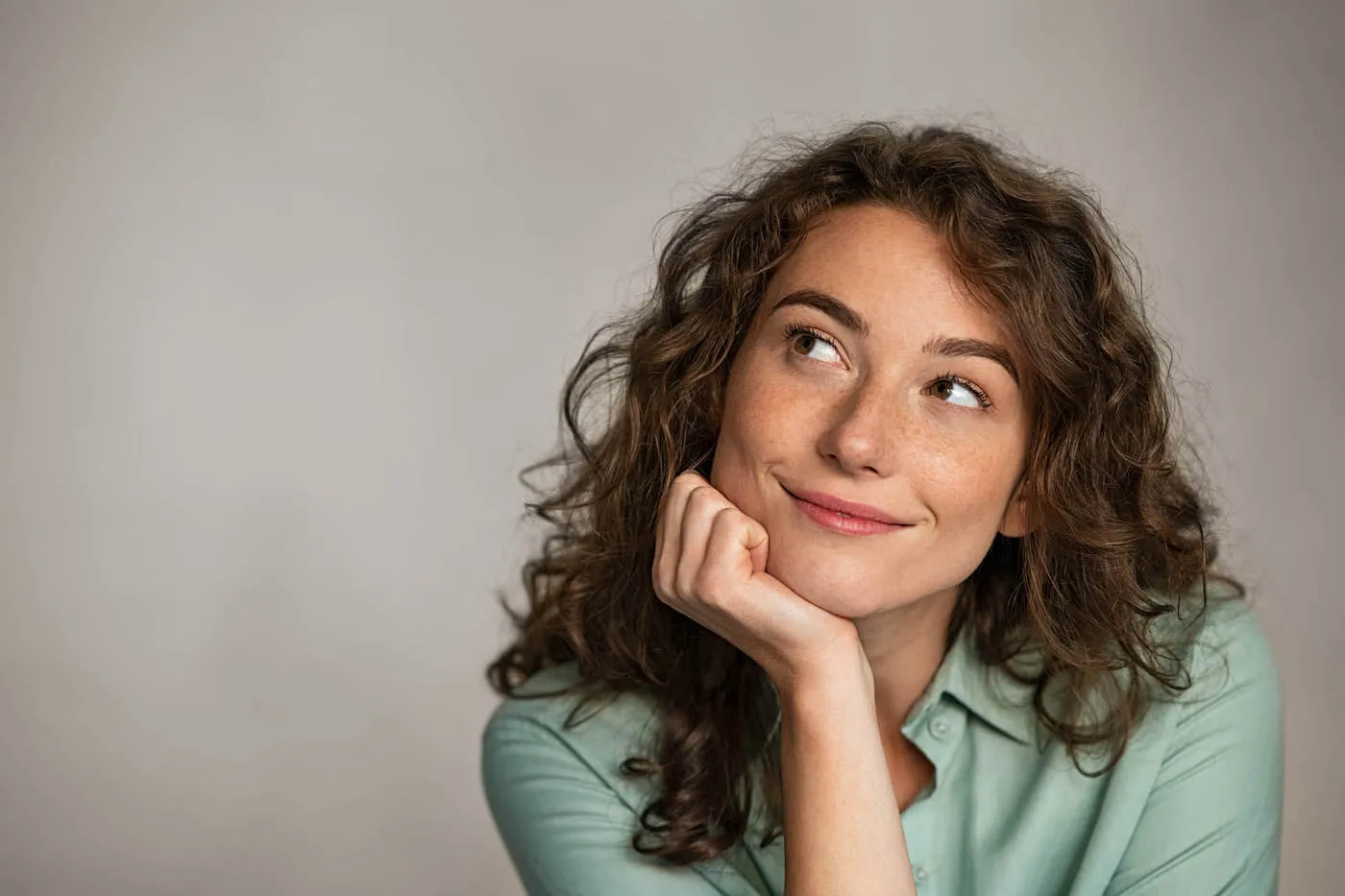 woman with a slight knowing smile