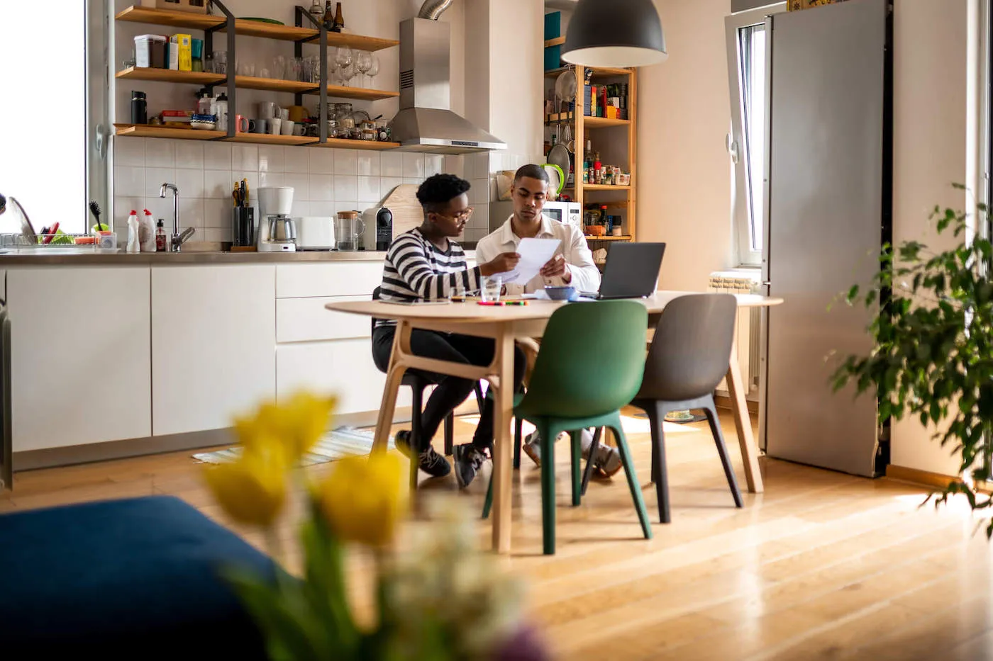 couple seated at table discussing medical bills