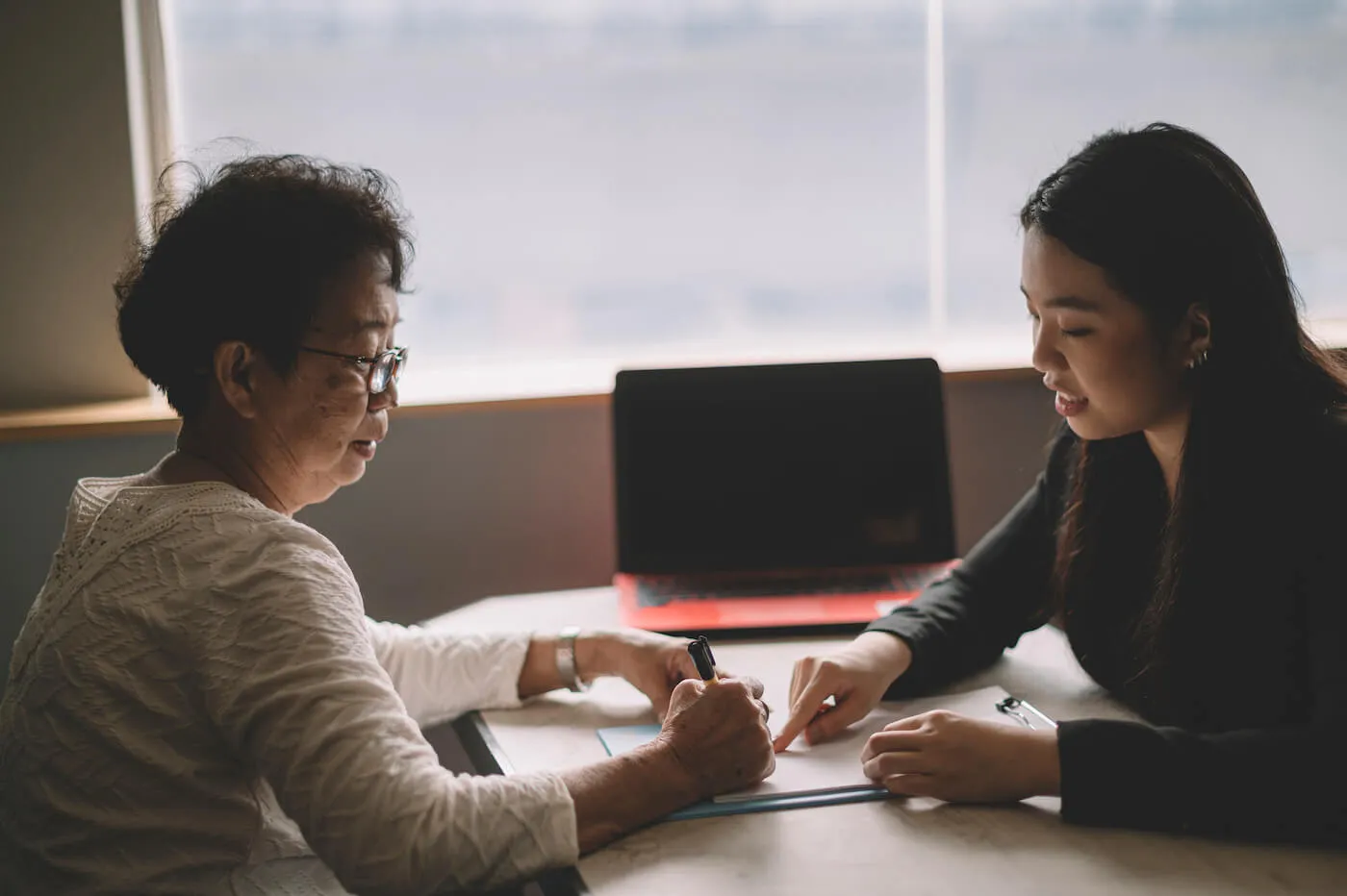 younger woman explaining to older woman different types of trust funds