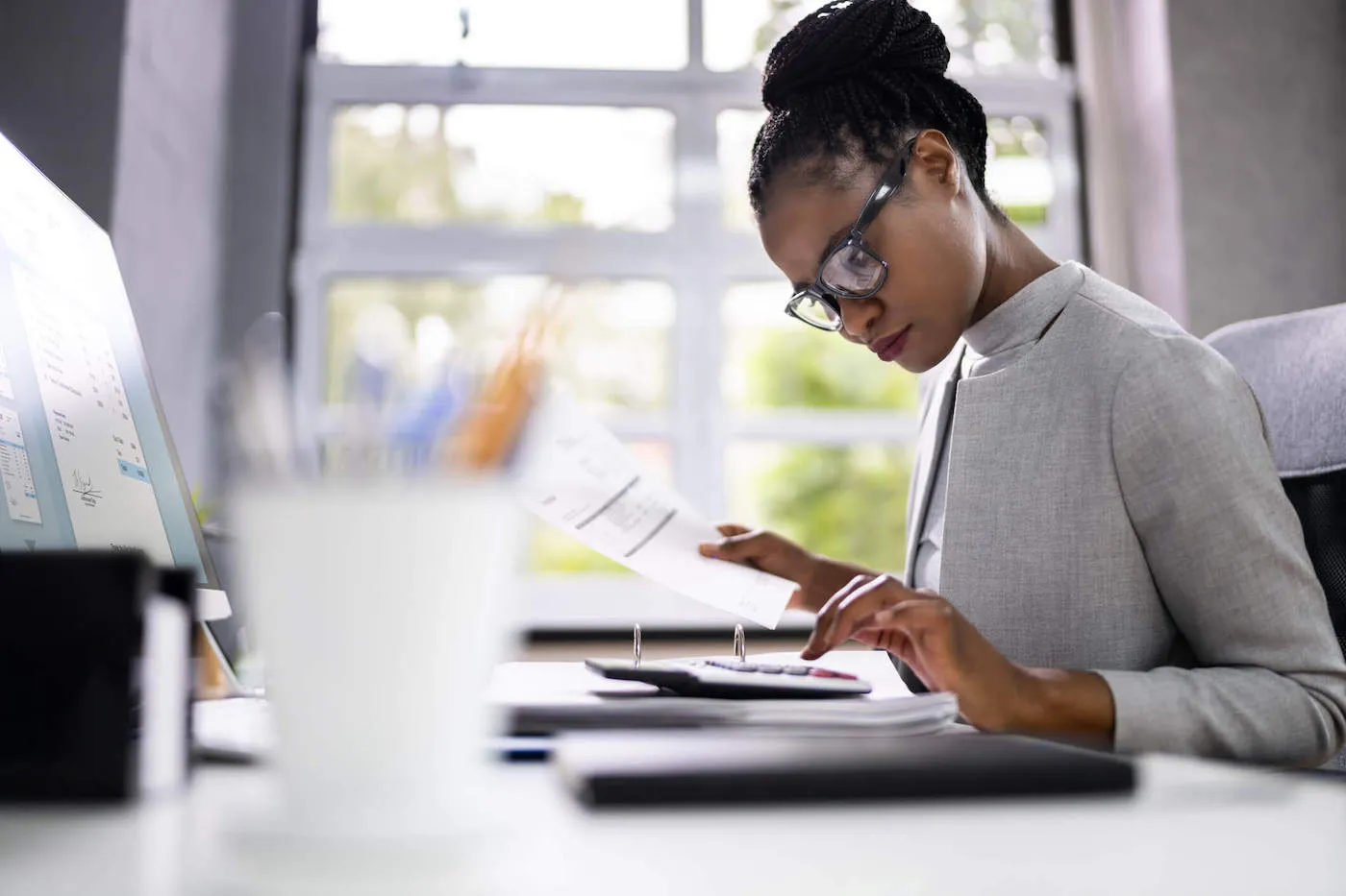 African American Financial Planner With Calculator.