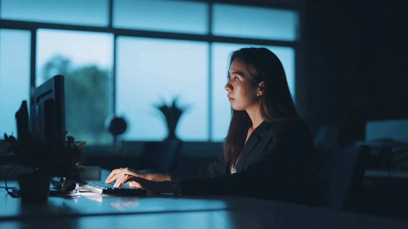 Asian businesswoman working late at night.