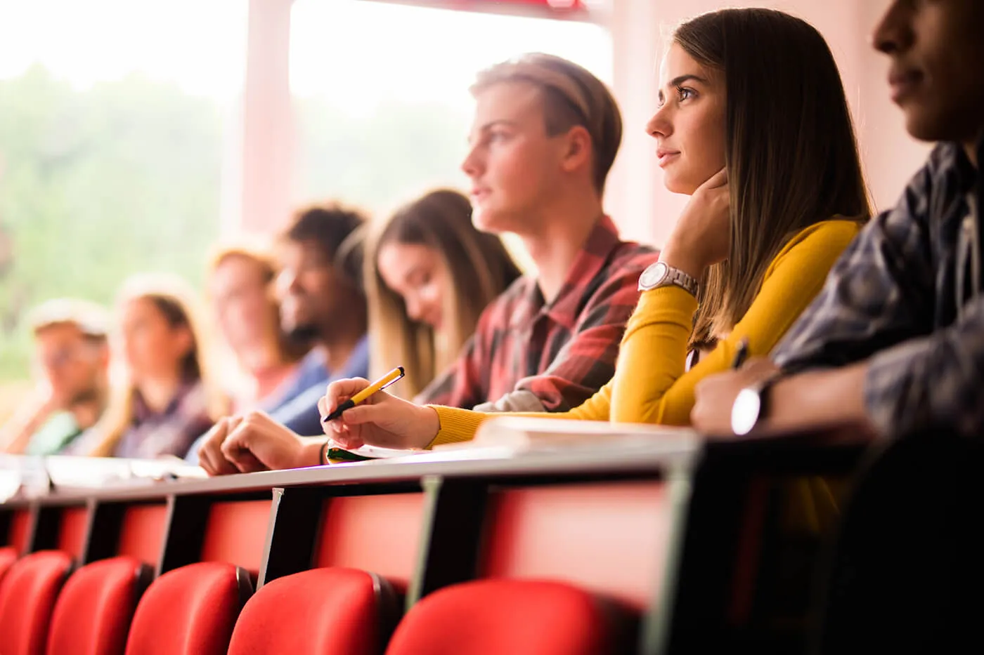 Large group of students attending a class at lecture hall