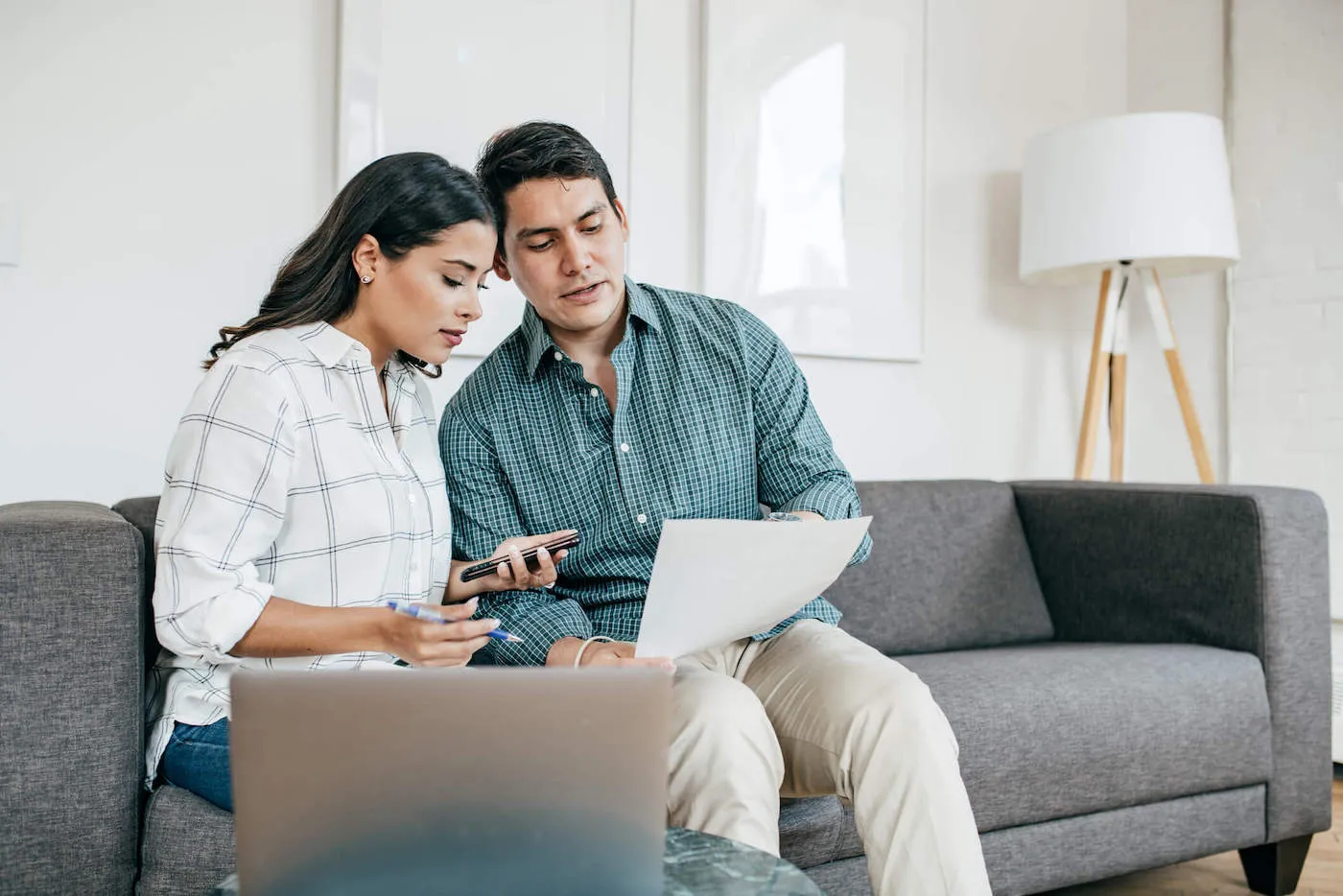 Couple looking on bank statements.