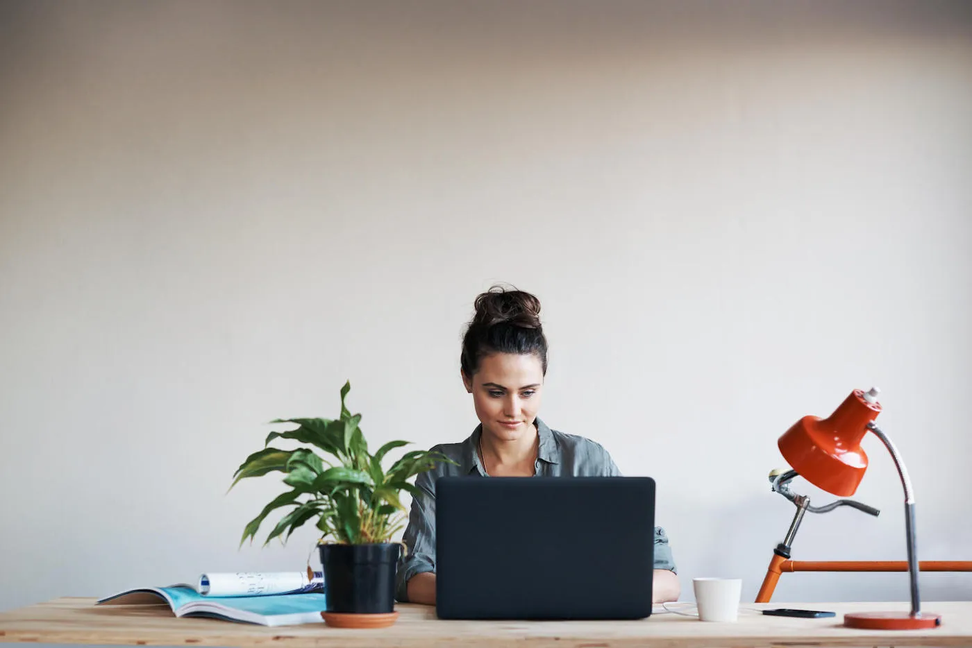 Cropped shot of a young businesswoman working from home.