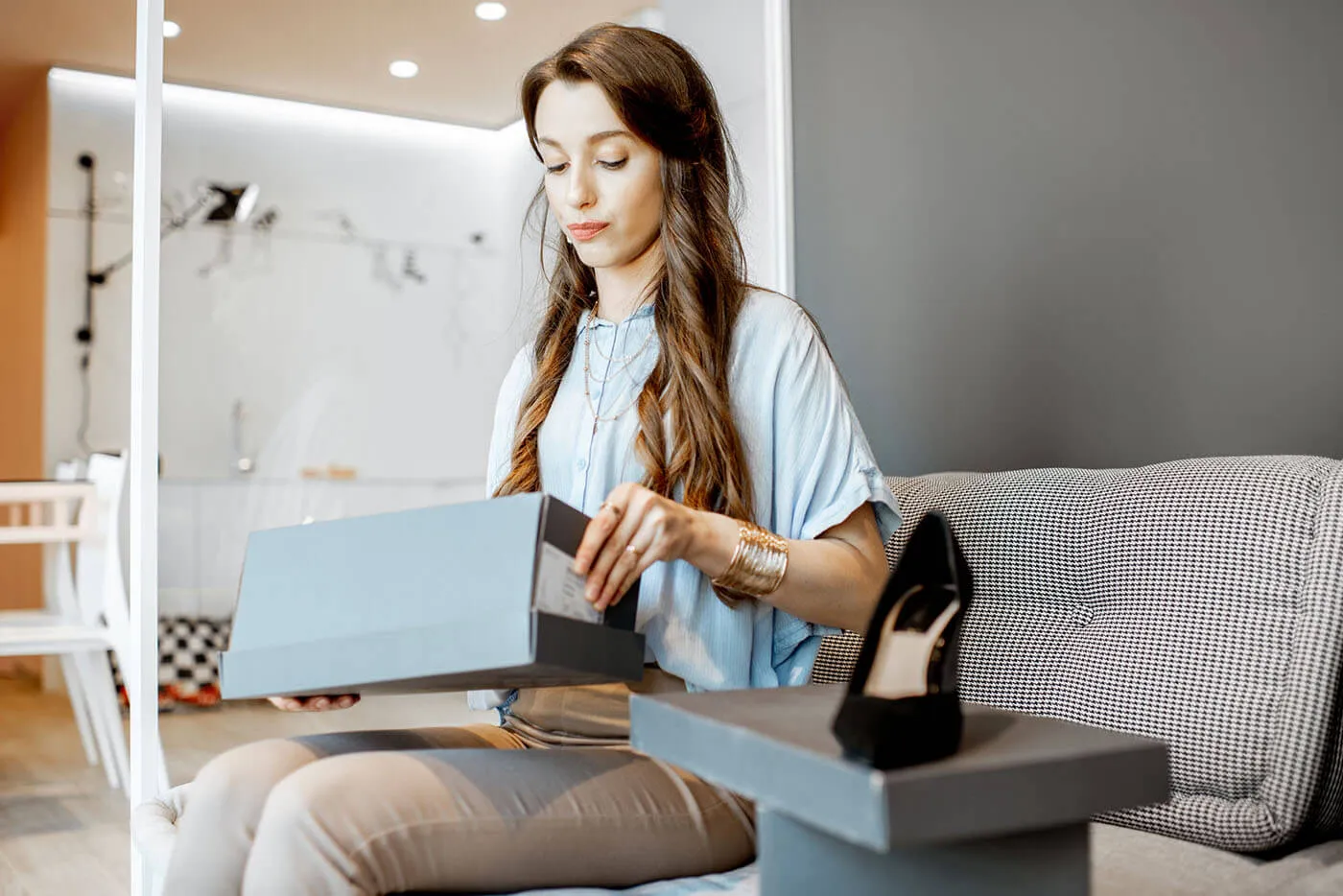 Woman holding a box with new shoes