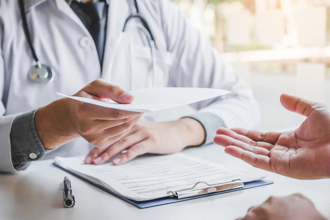 doctor handing out medical bill paper to patient