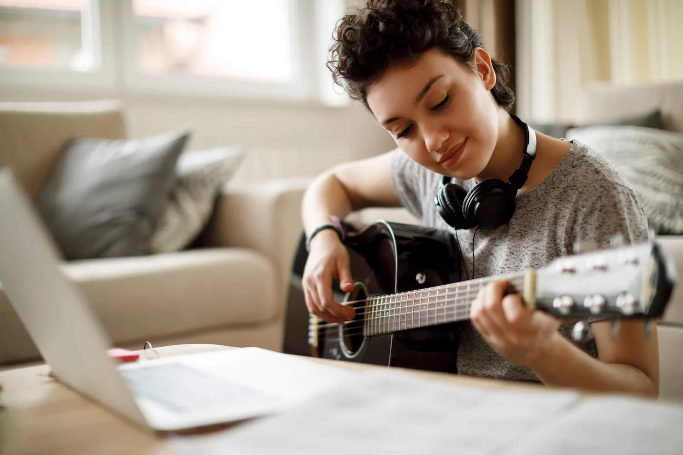 woman playing a guitar