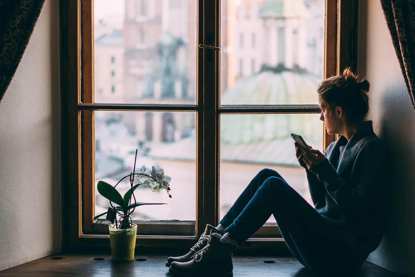 Woman sitting in the windowsill.