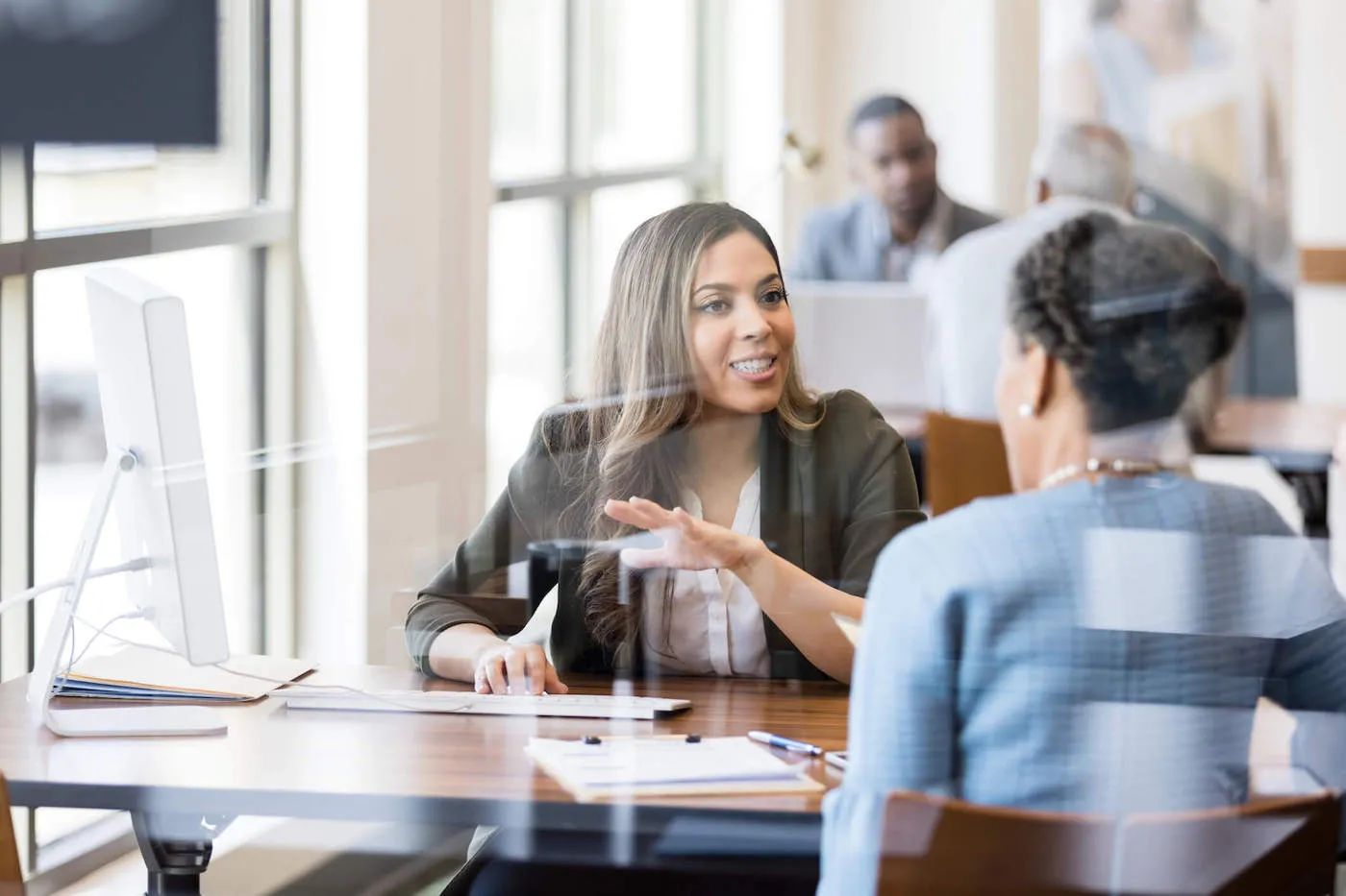 woman giving financial guidance to female client