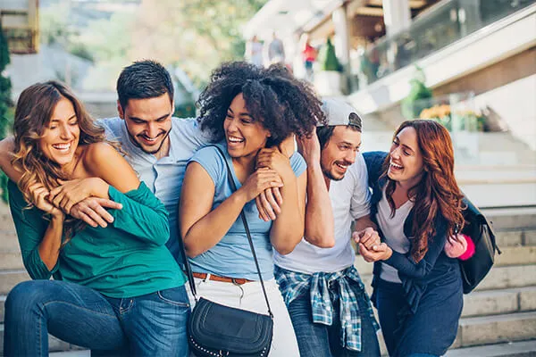 group of young adults happy to save money