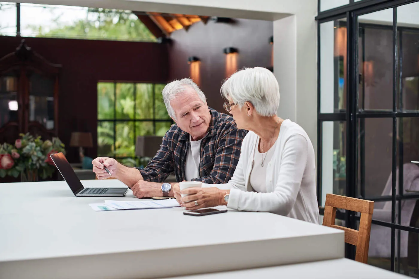 Shot of a senior couple using a laptop at home.