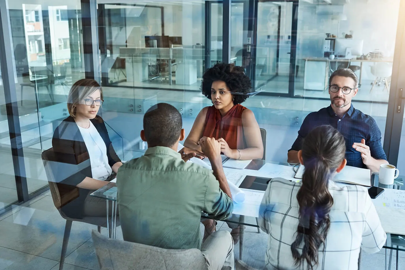 group of people having a meeting in a corporate office