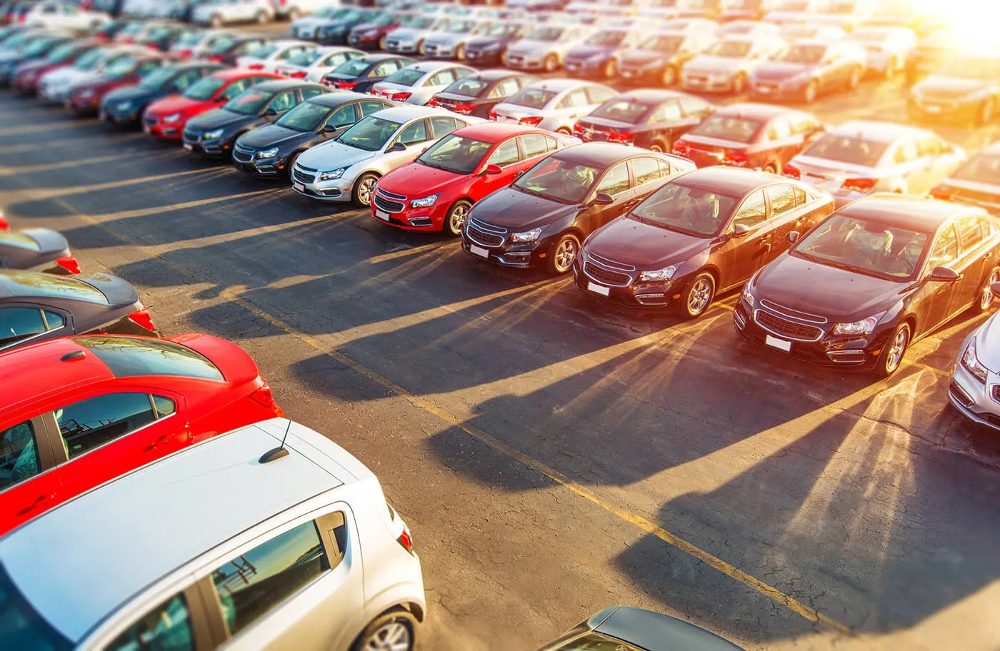 Colorful Brand New Compact Vehicles For Sale Awaiting on the Dealer Parking Lot.