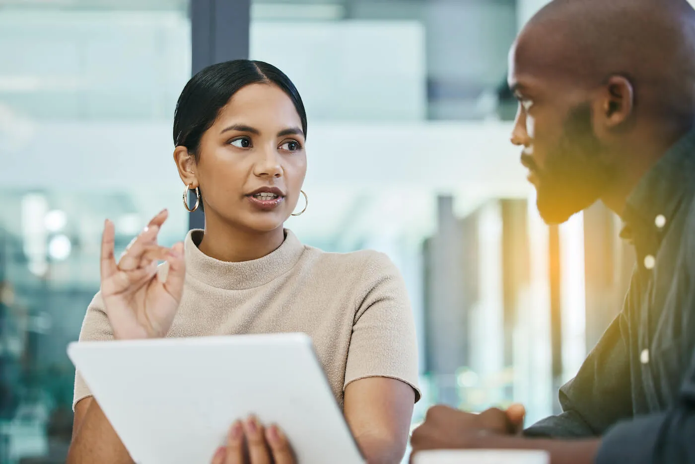 woman explaining to a man shorting stocks