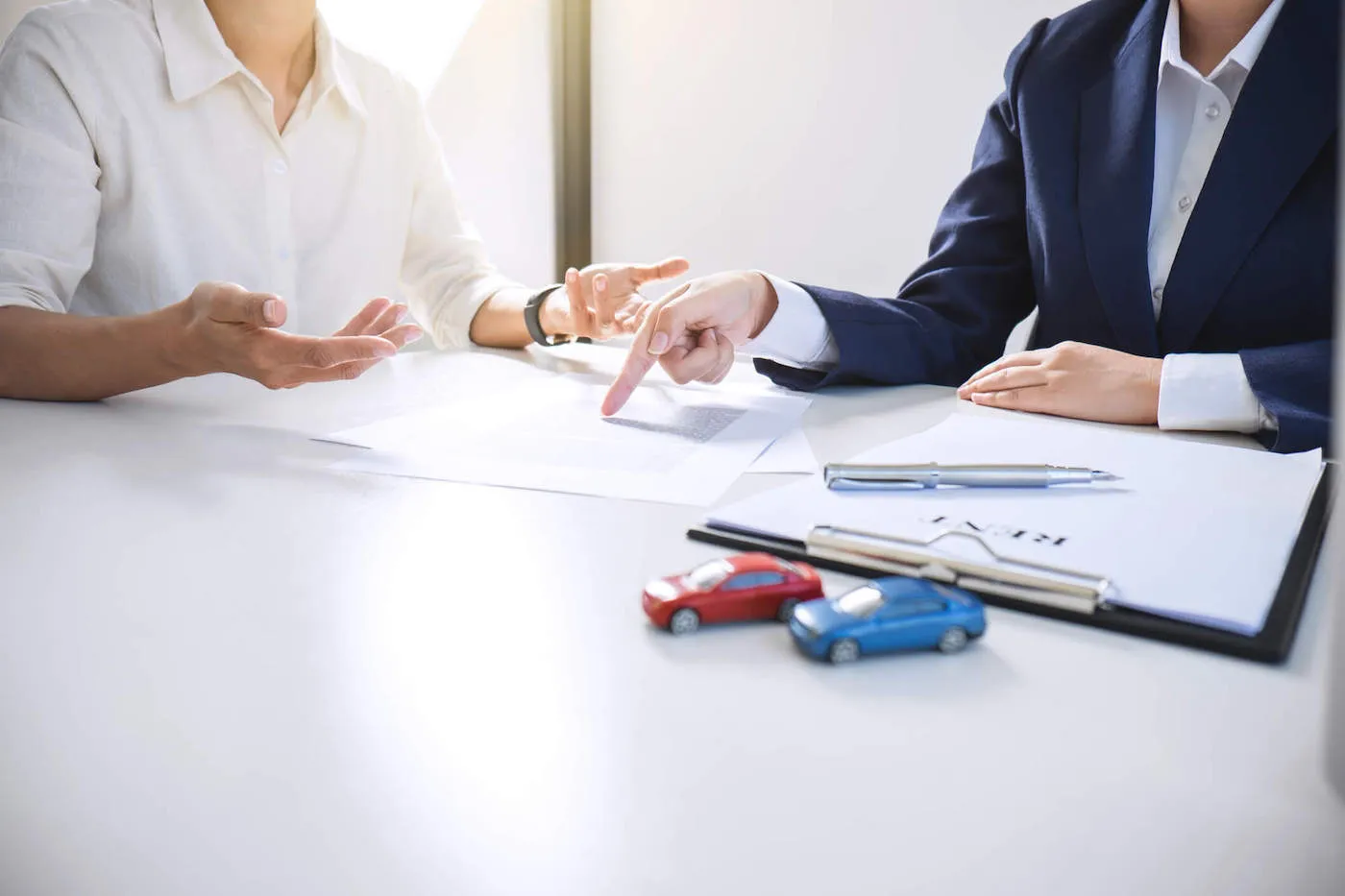 two people negotiating medical payment coverage on a car insurance policy