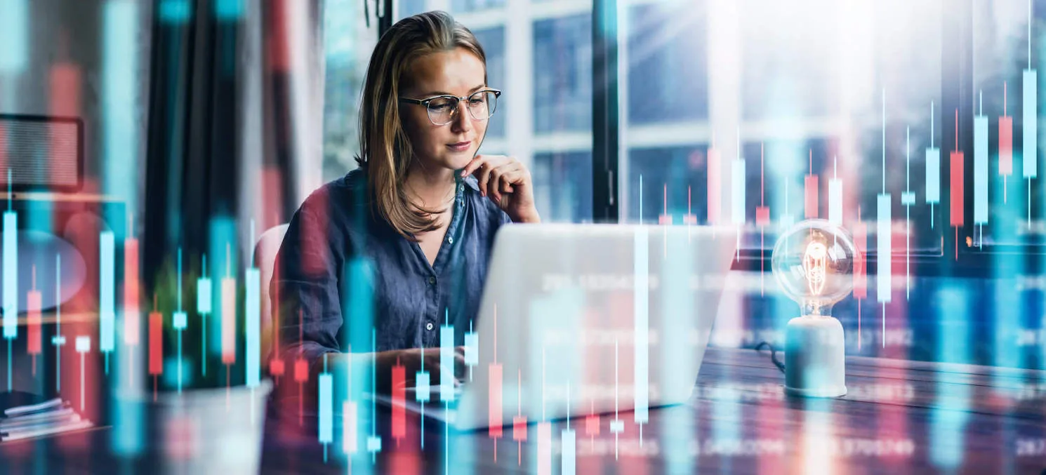 woman sitting in front of laptop paying bills