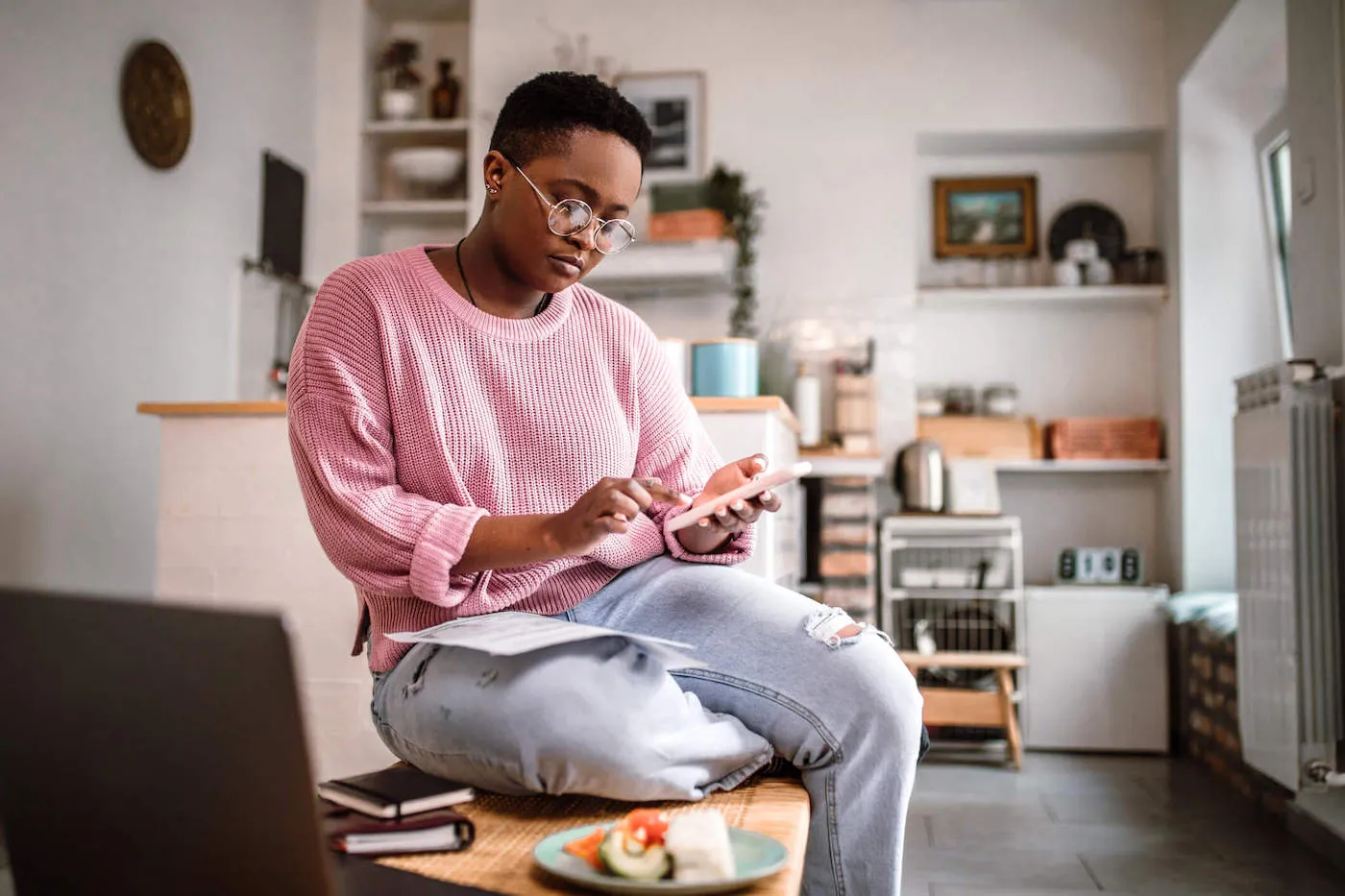 Young woman doing home finances at home.