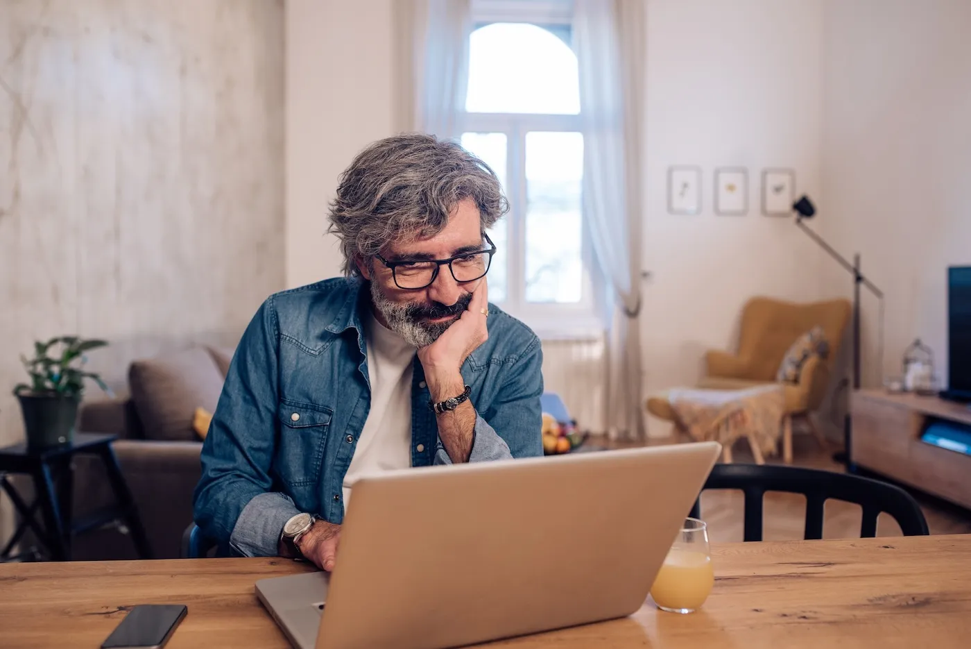 Mature man working on his laptop.