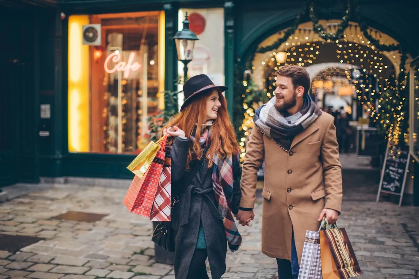 A happy couple doing holiday shopping