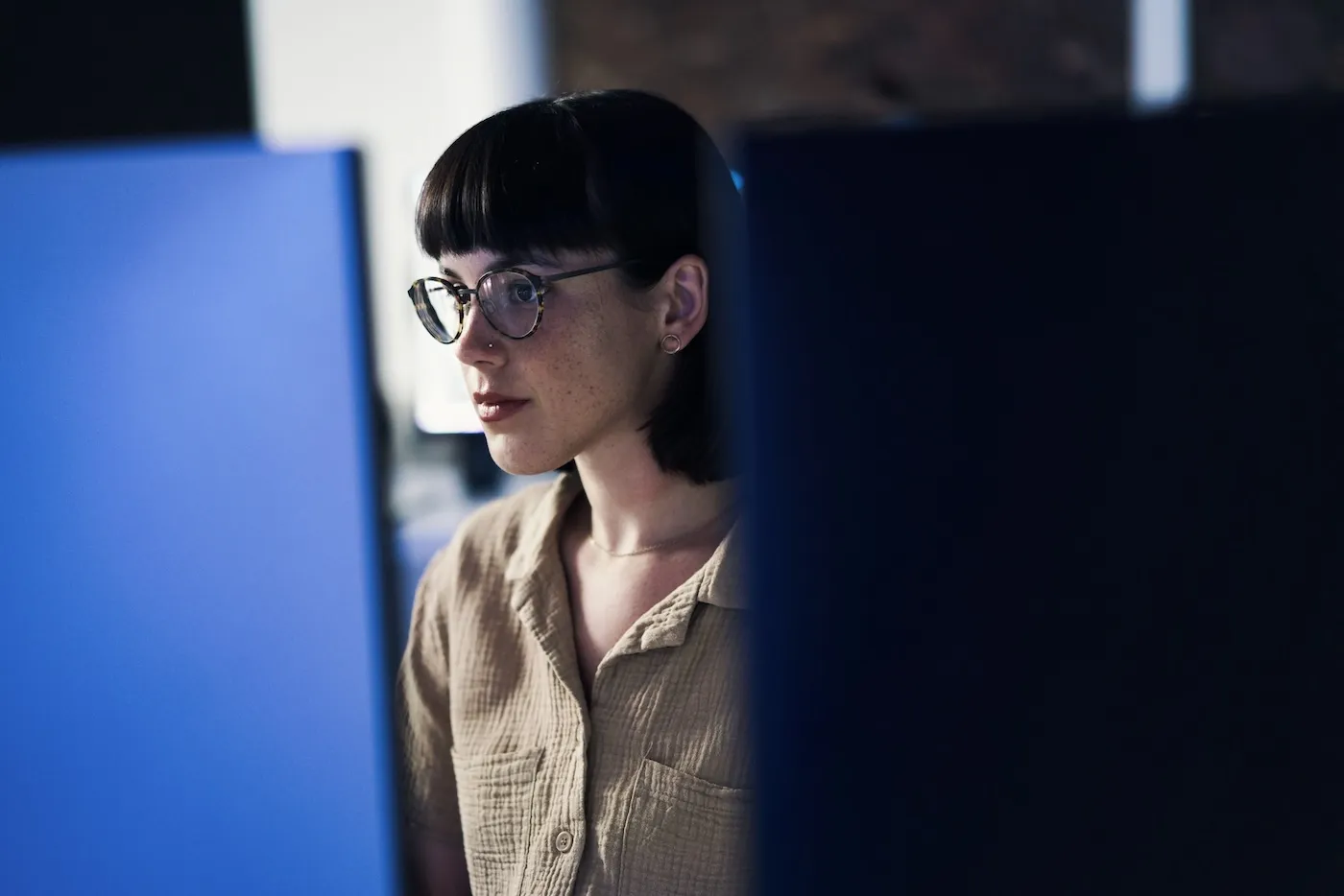 Concentrating, serious woman working on her finances.