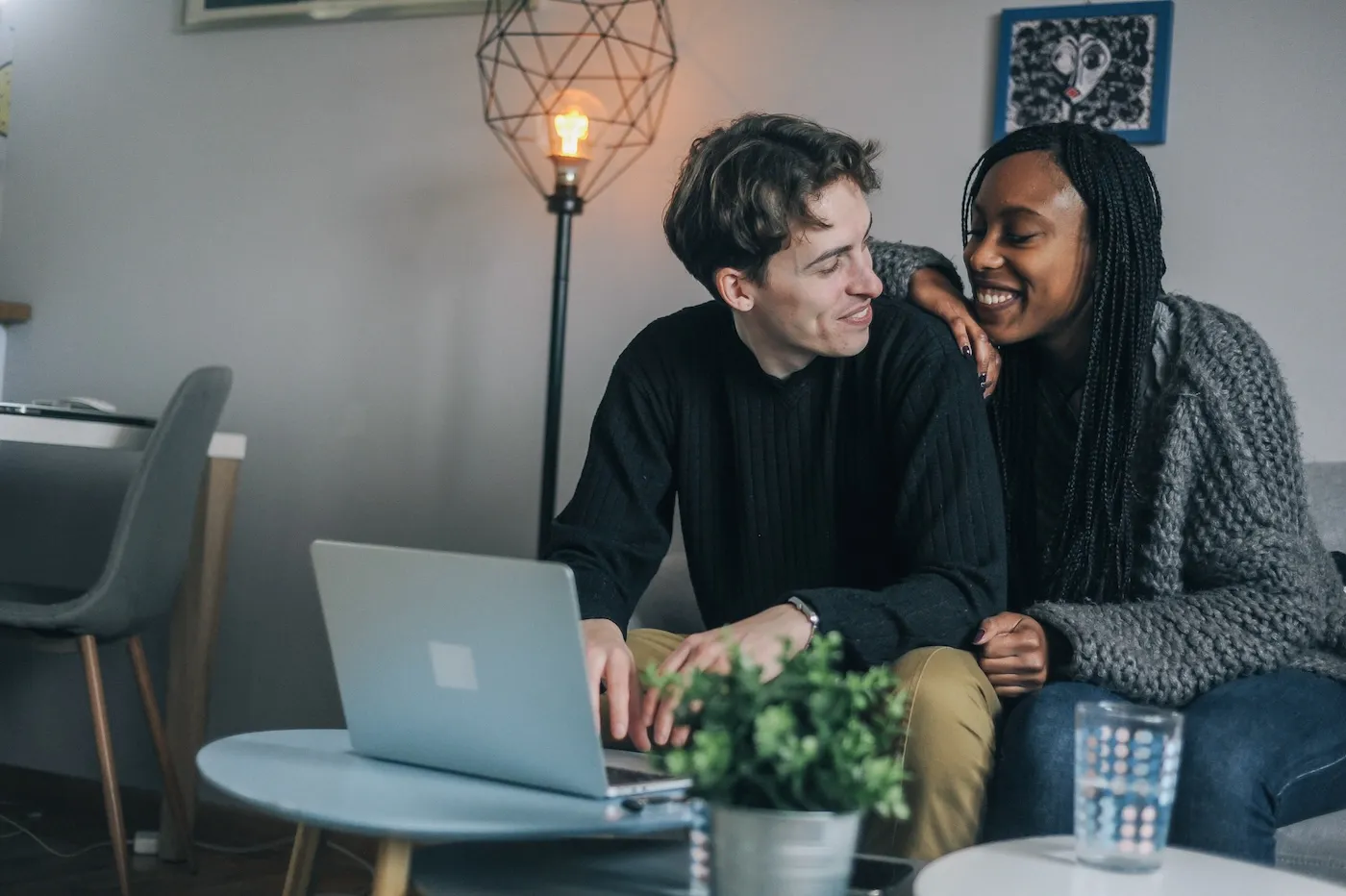 Young couple at home planning their finances.