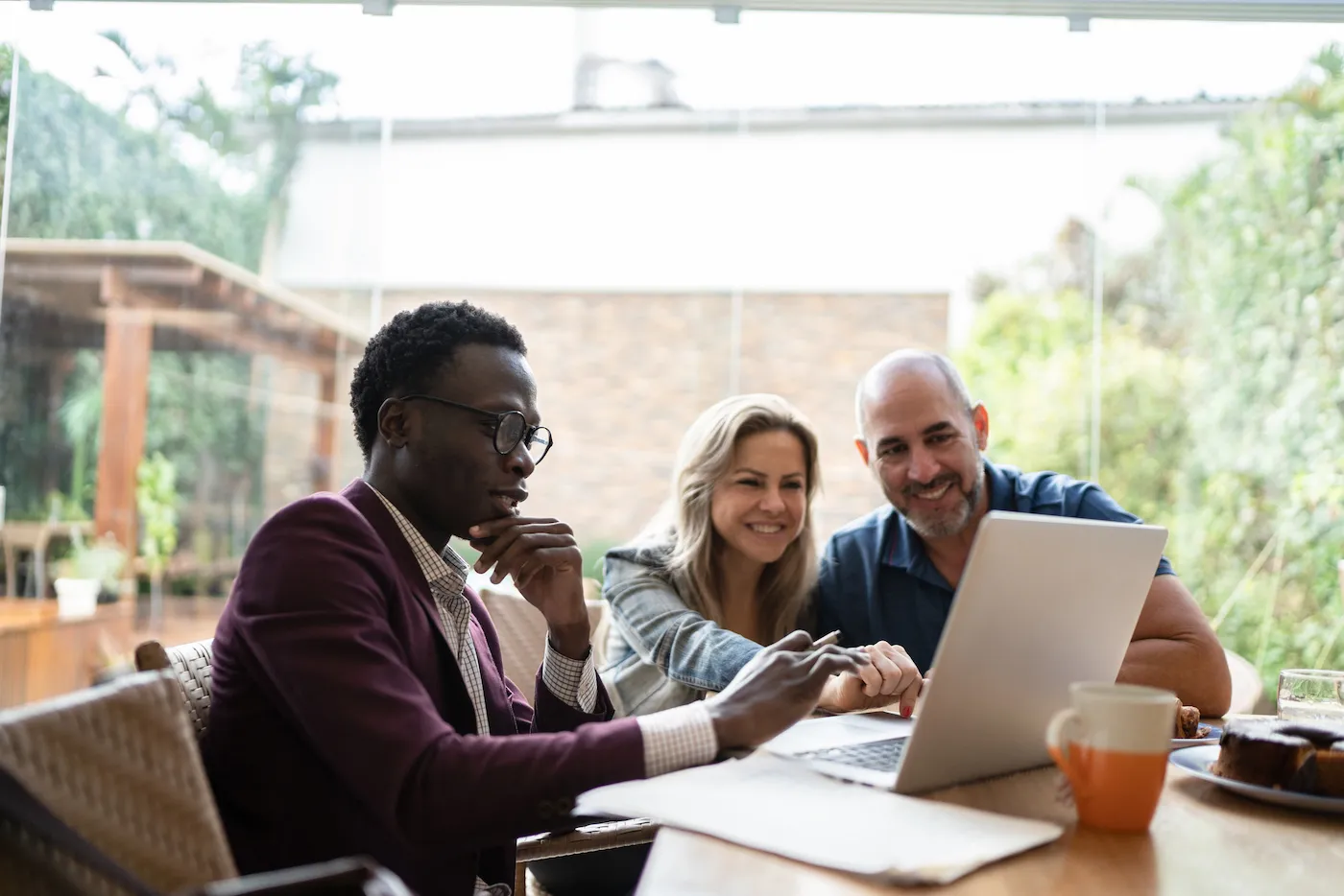 Couple meeting with financial advisor doing property taxes