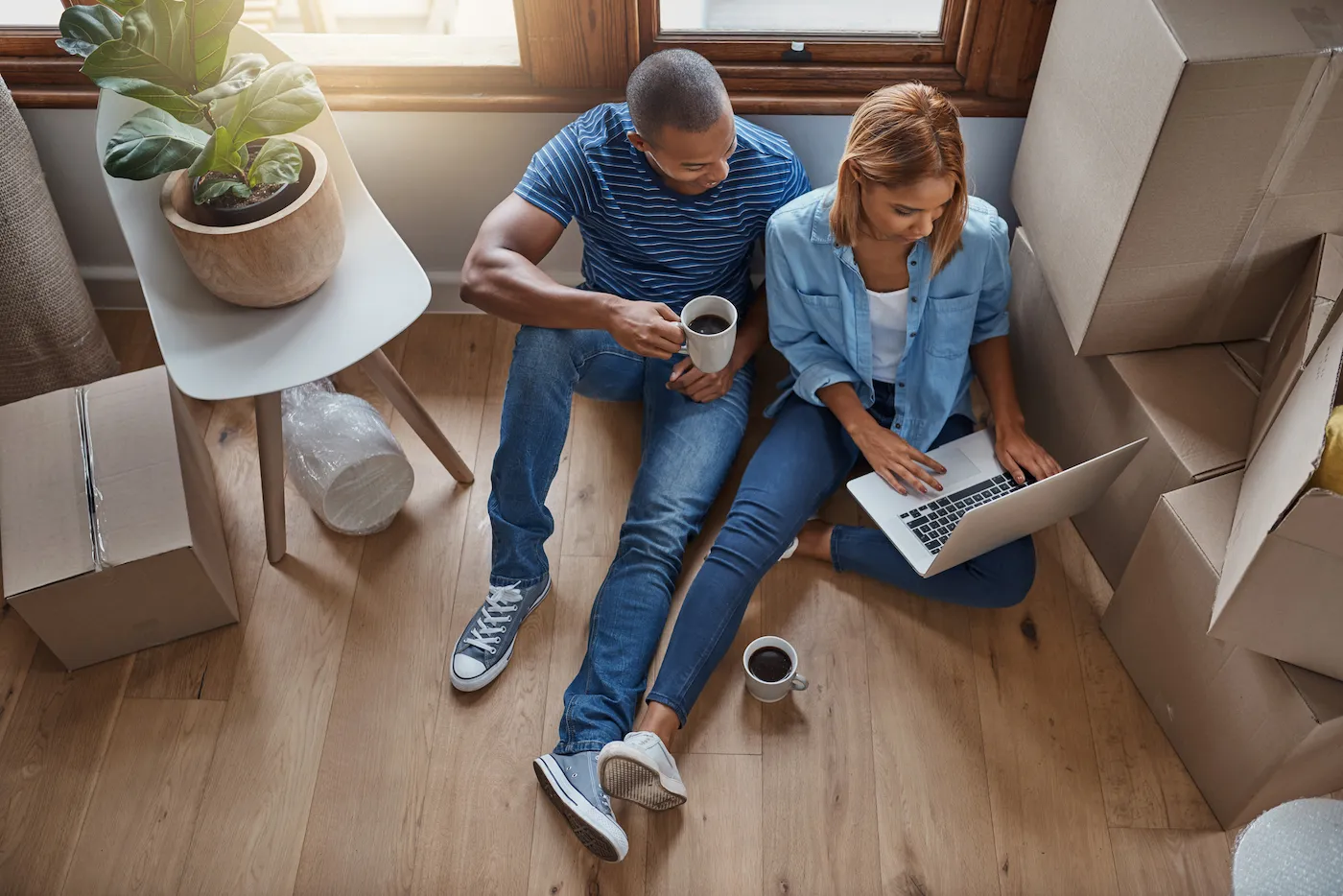 Couple using a laptop to review their new mortgage