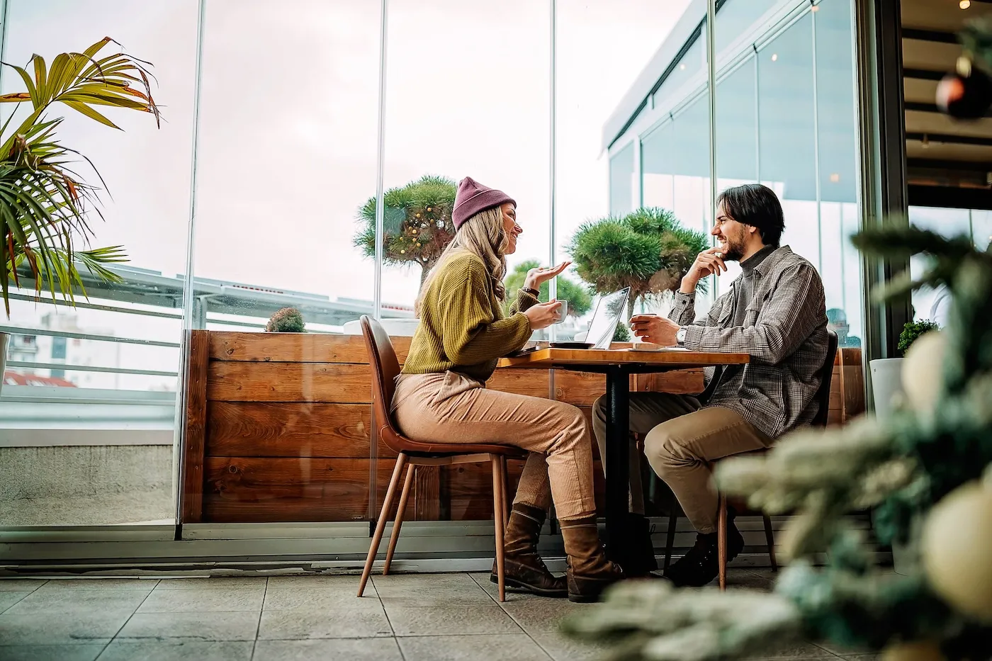 Young couple on a date in cafe, talking about credit