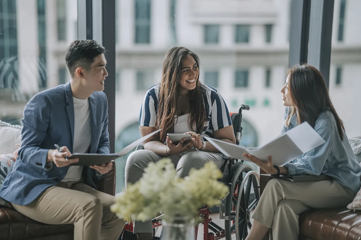 Three colleagues discussing no-penalty CDs.