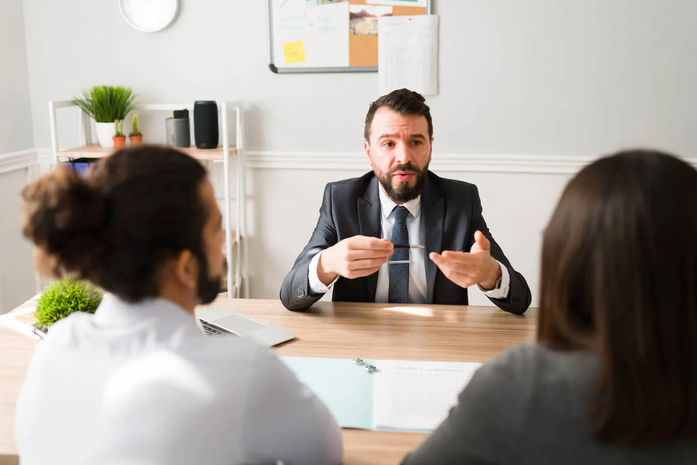 Divorced couple consulting on how to handle shared home.