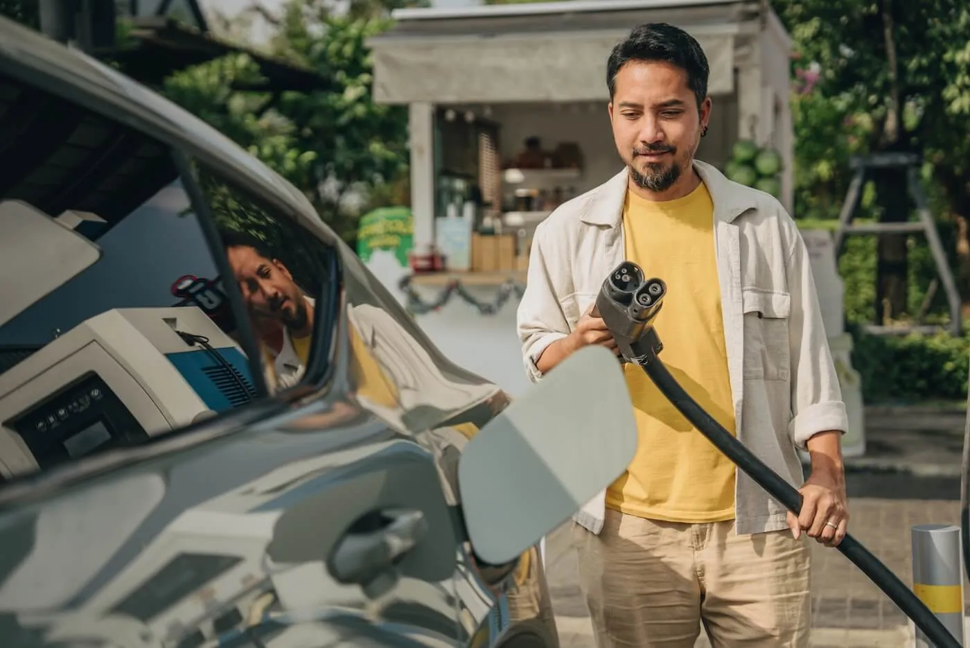 Man is going to charge his electric vehicle