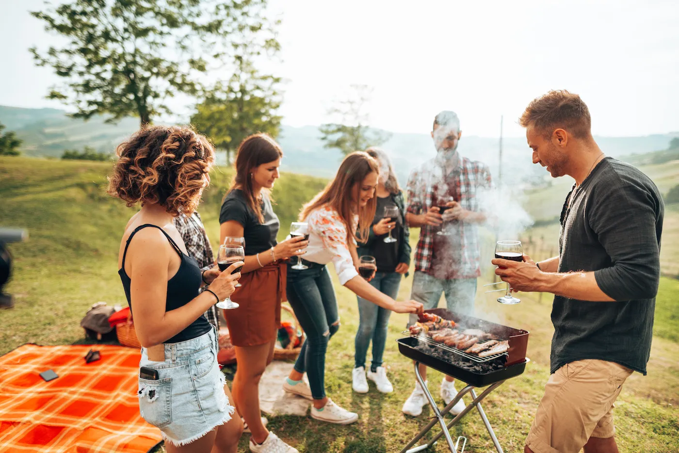 friends toasting together for the bbq