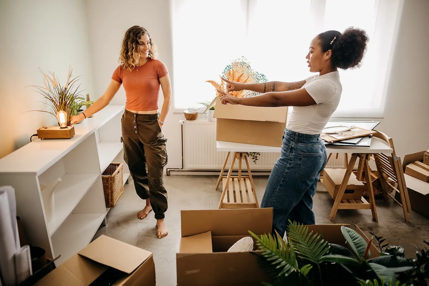 Two women decorating their home.