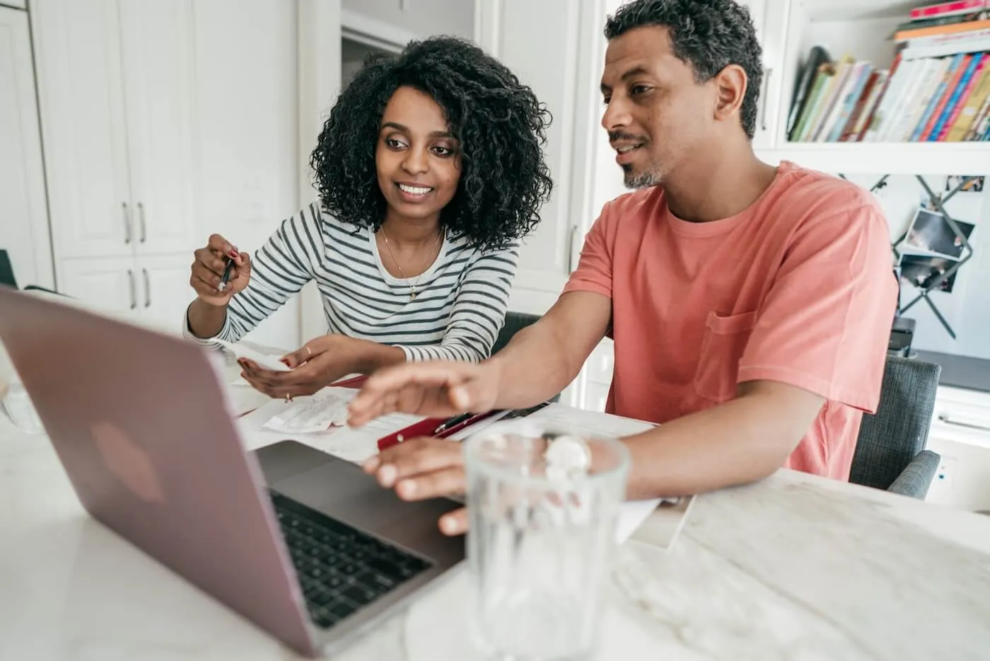 Young couple deciding how much money to put on their CD account