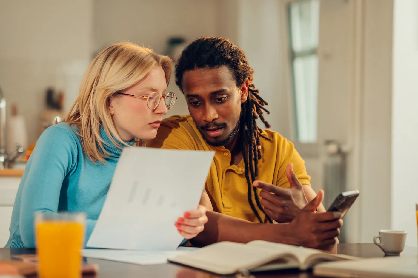 Two people reviewing their mortgage insurance together.