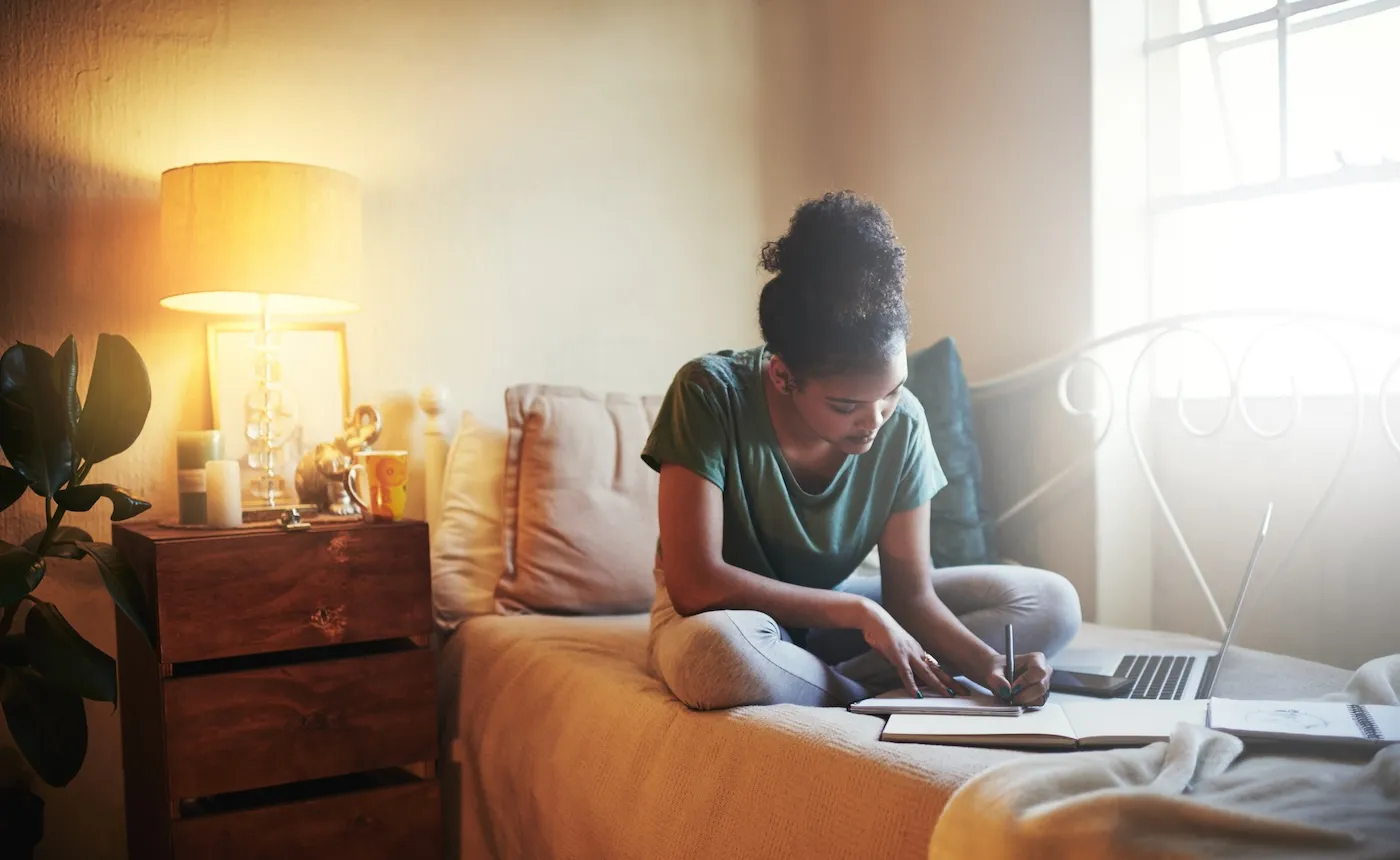 A young female student studying at home