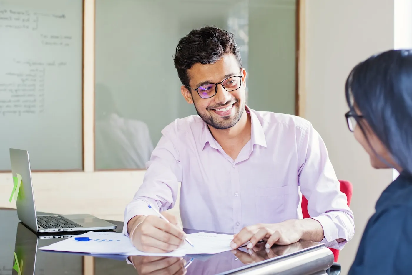 A man explaining mutual funds to a colleague