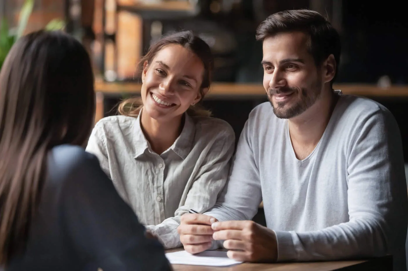 Man and woman couple getting versed about their students loans.