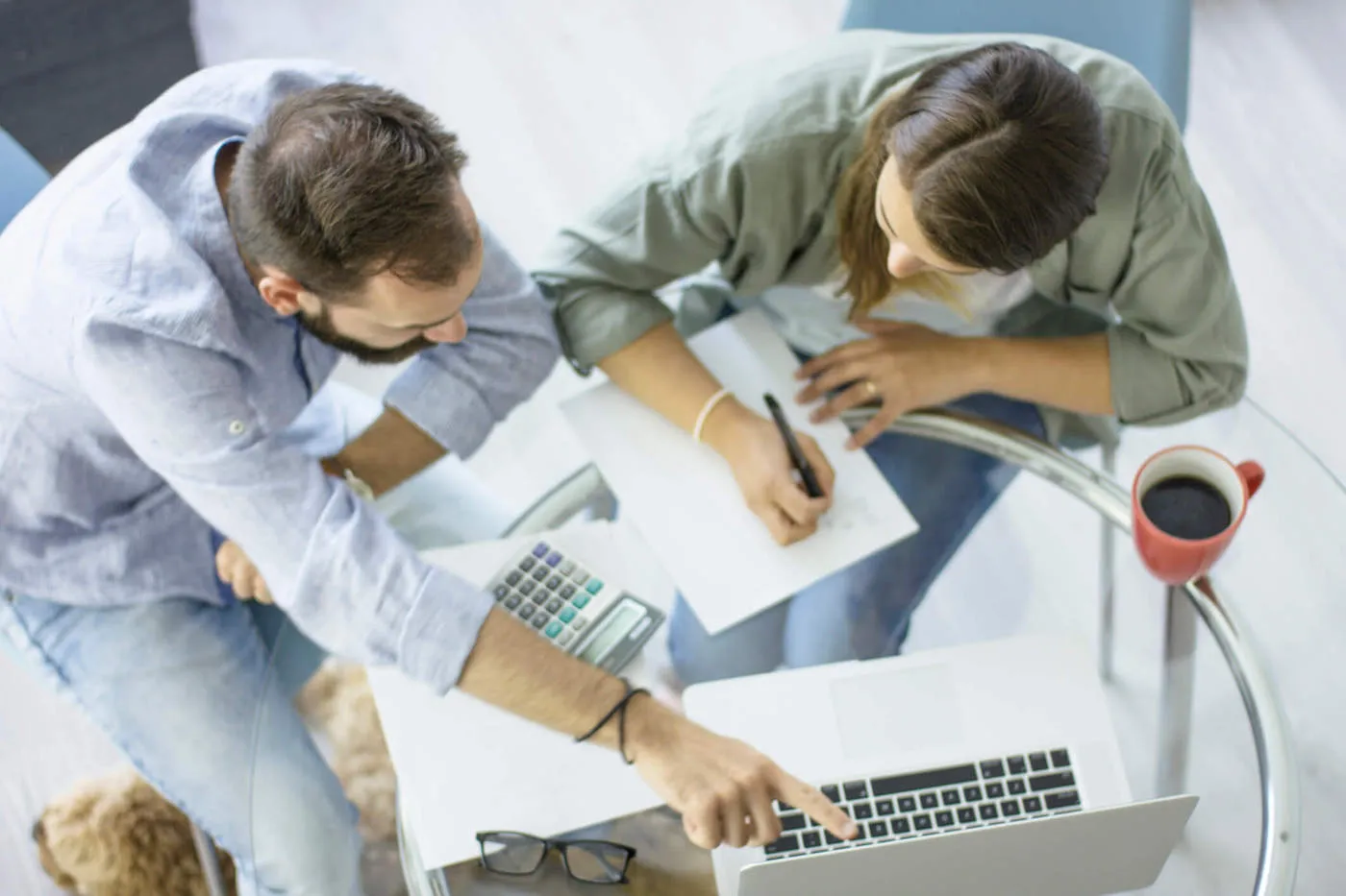 Man and woman couple in regular clothing researching rate and term refinancing.