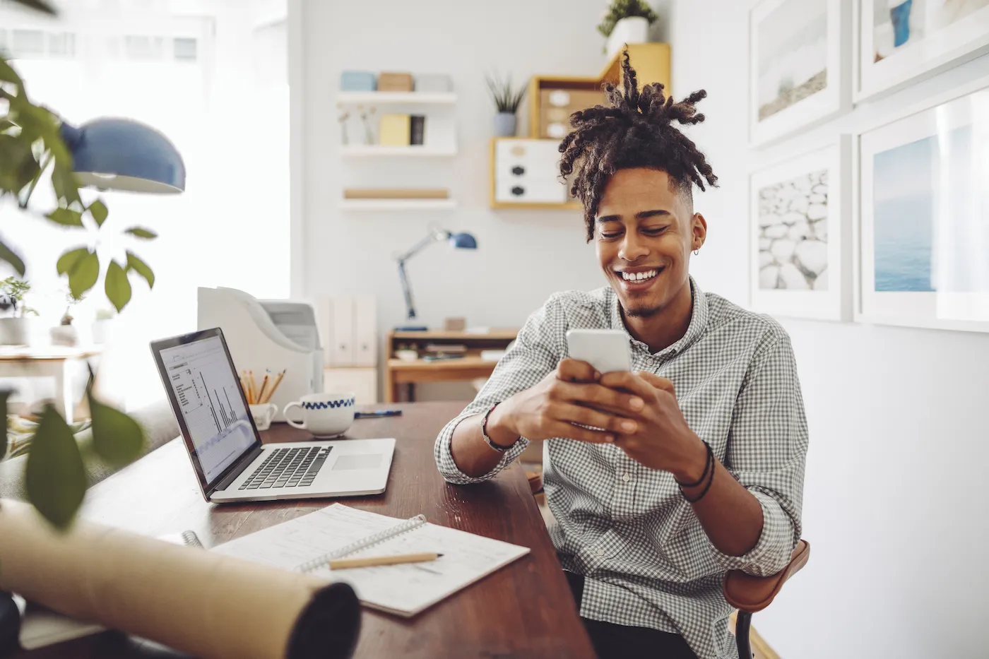 Man checking his investments online in his home office