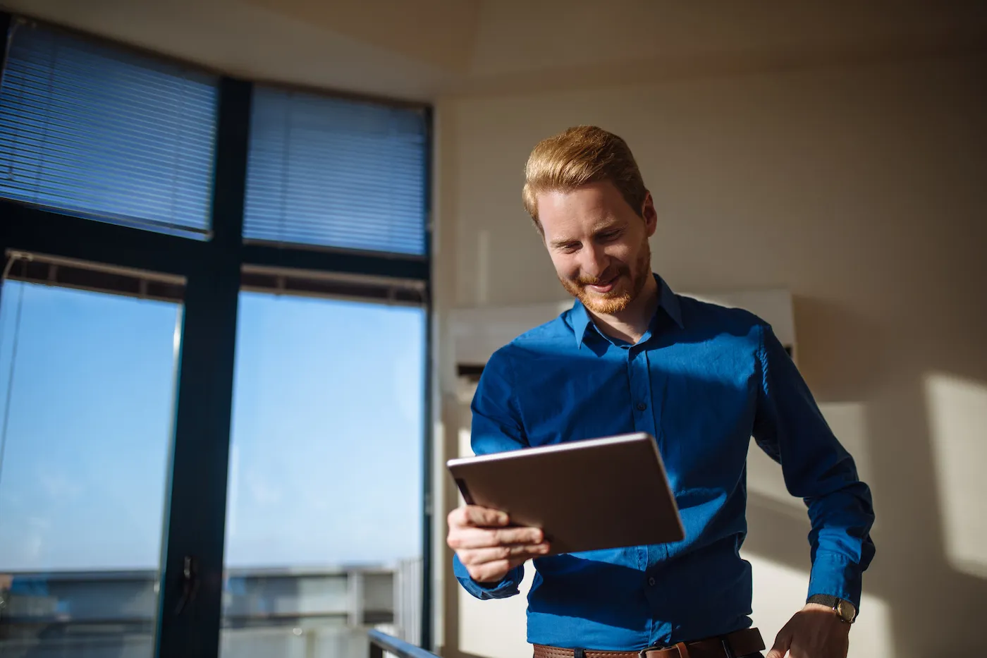 Man using digital tablet to check savings account