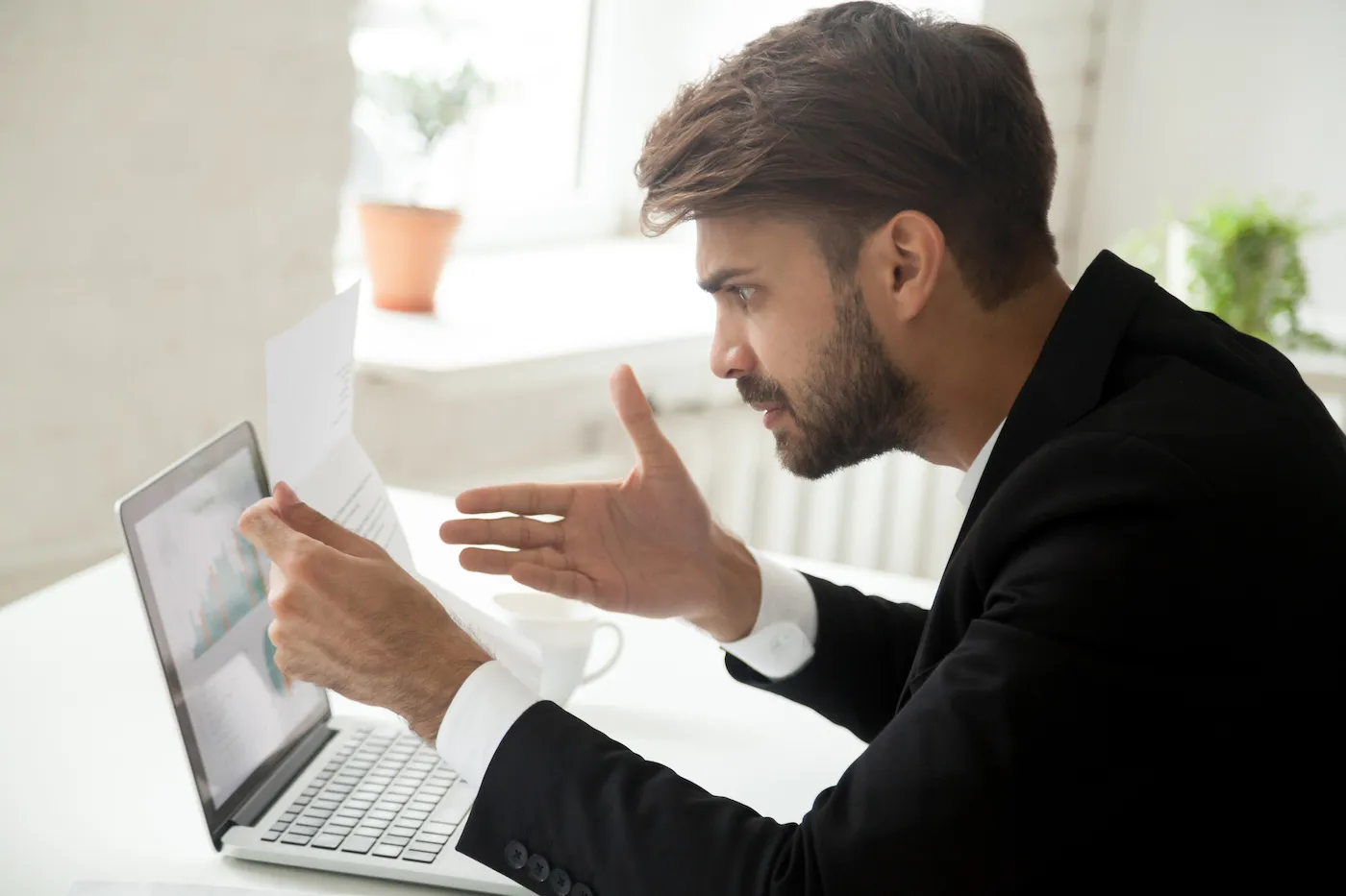 A man discovers in a letter that his debt has gone to collections.