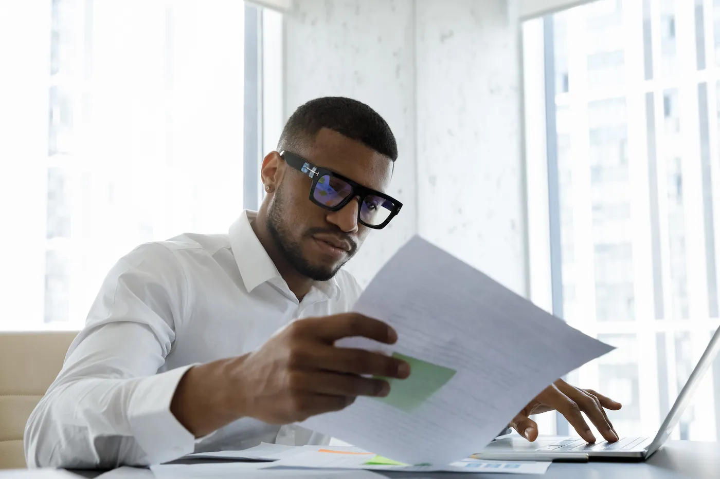 Man working on his budget, building a buffer into it