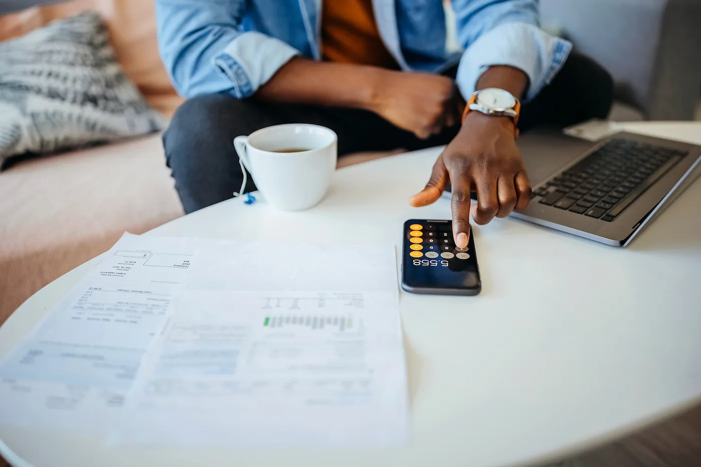 Unrecognisable man going over his finances