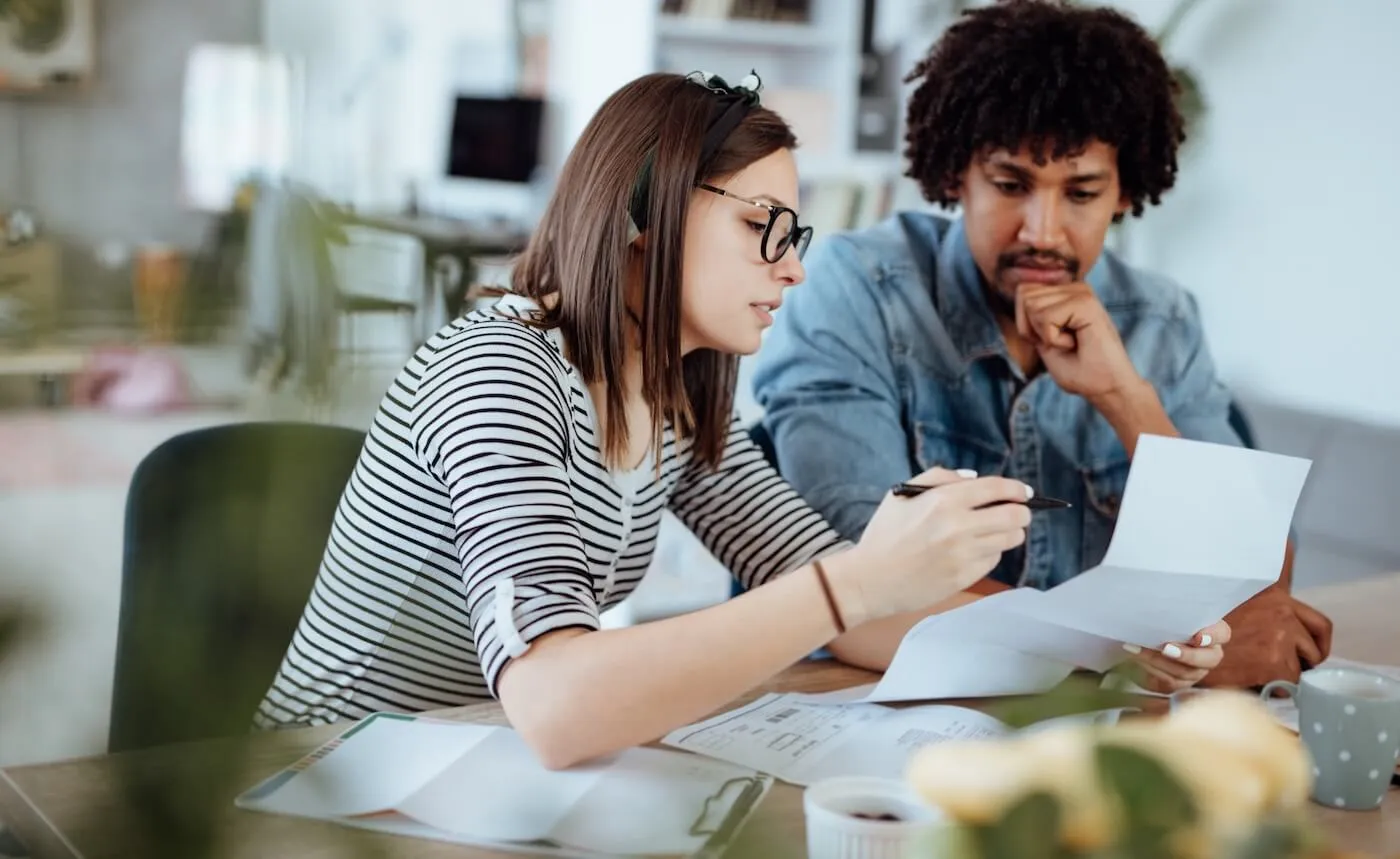 Couple reviewing bills in the kitchen