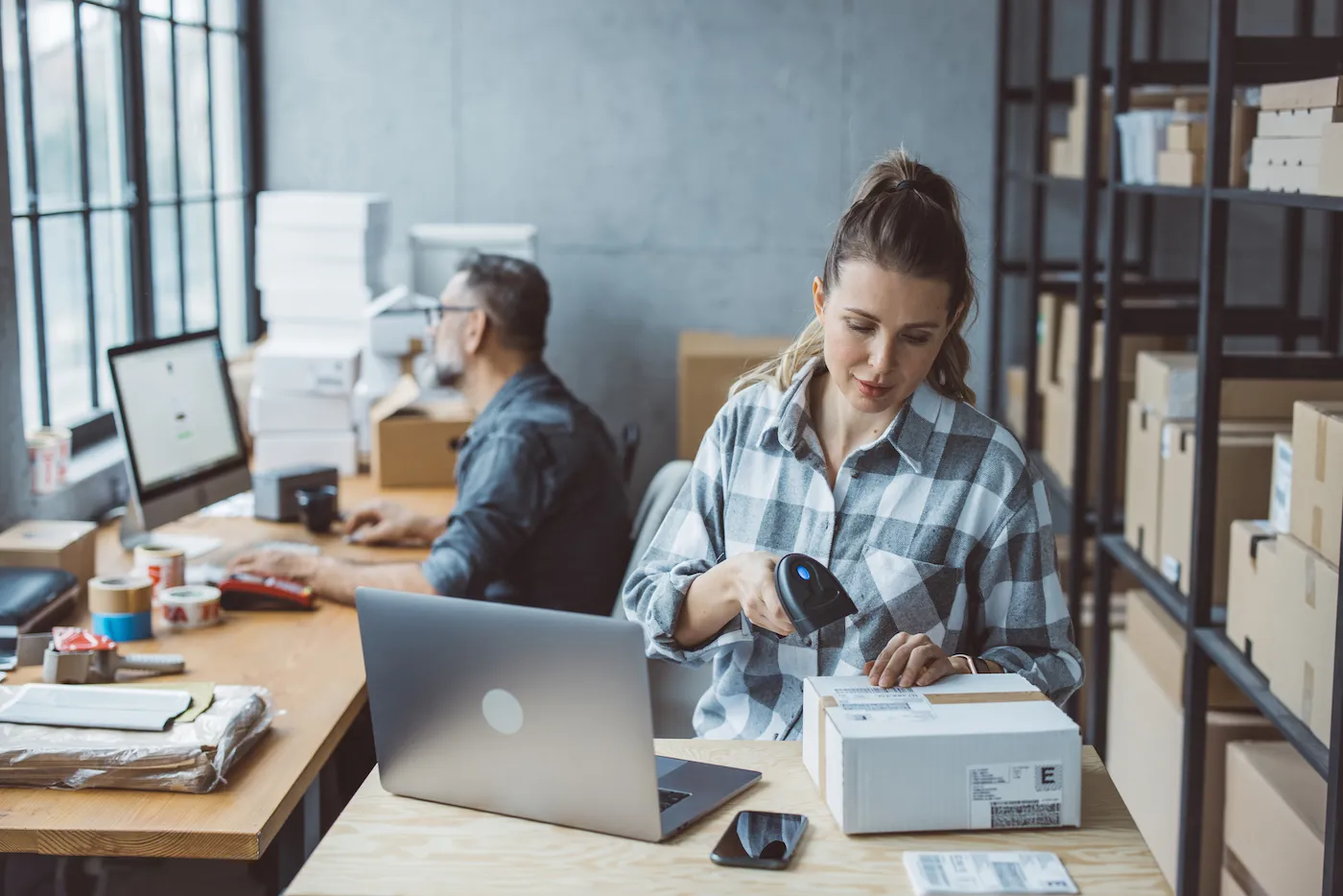 Online marketplace seller shipping boxes in an office