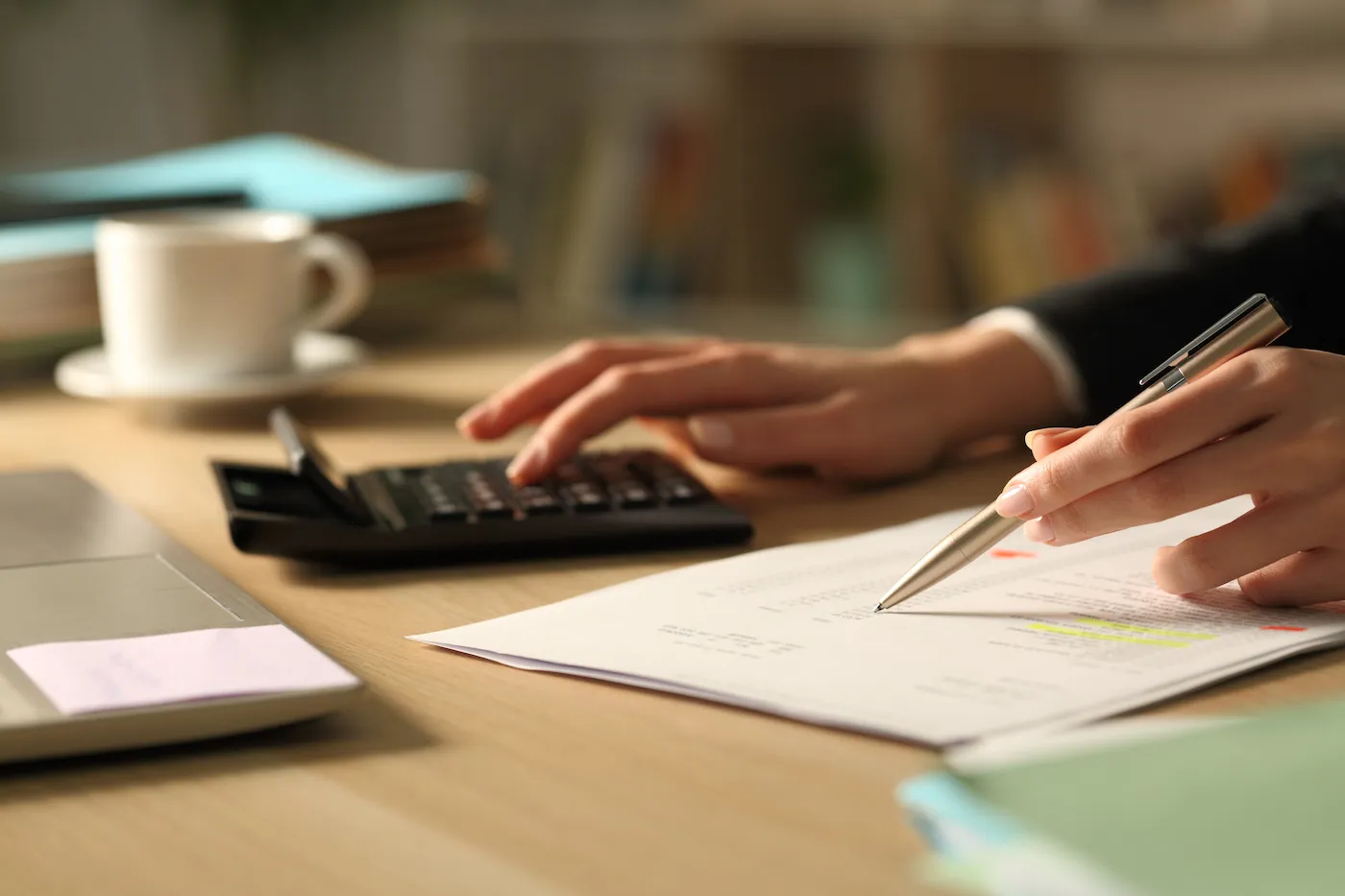 Person using calculator on a desk