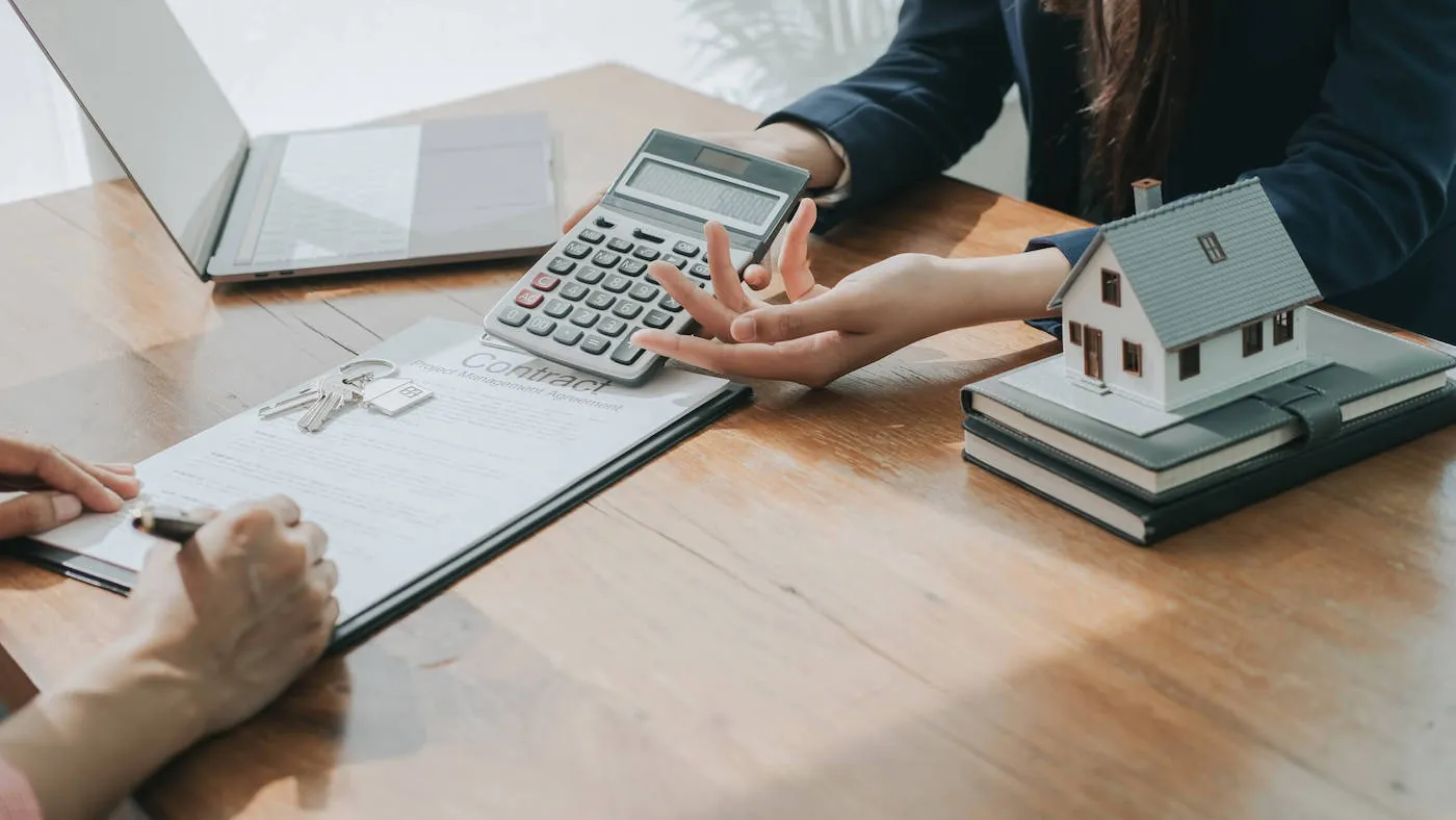 Real estate broker walking person through using home equity.