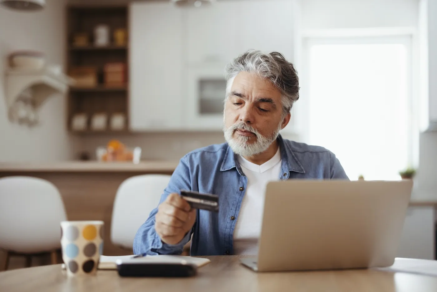 Mature man thinking of reopening his old credit card