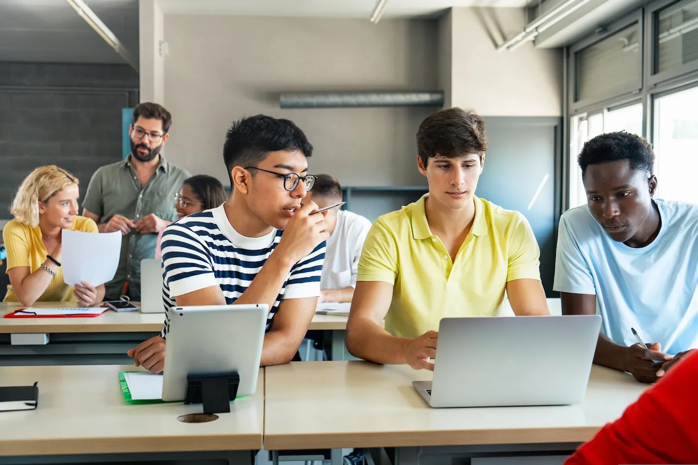 Group Of Teenage Students planning how to fund college.